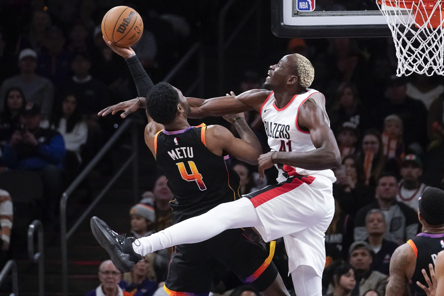 Portland Trail Blazers&#039; Ibou Badji (41) fouls Phoenix Suns&#039; Chimezie Metu (4) during the second half of an NBA basketball game in Phoenix, Monday, Jan. 1, 2024.