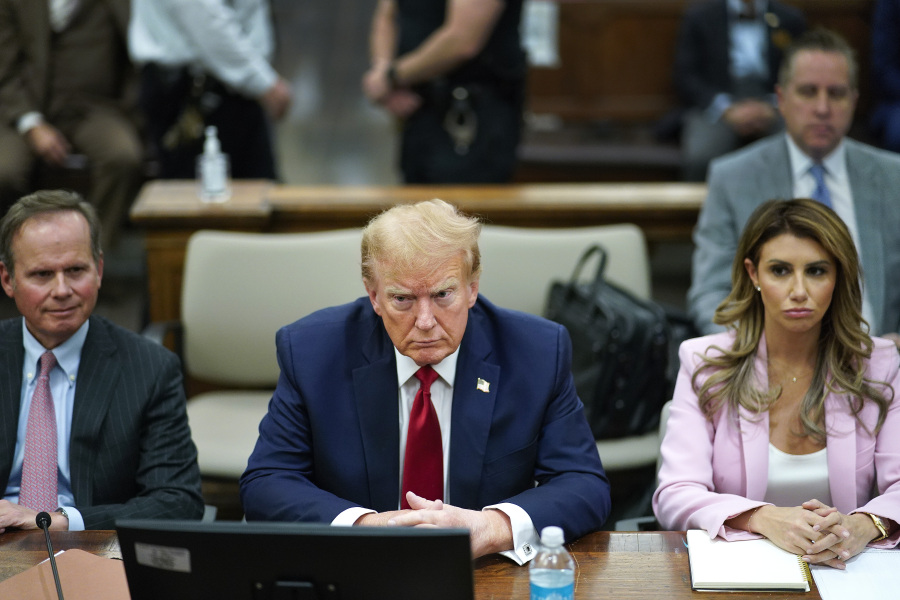 FILE - Former President Donald Trump, center, sits at the defense table with his attorney&#039;s Christopher Kise, left, and Alina Habba, at New York Supreme Court, Dec. 7, 2023, in New York. Testy encounters between lawyers for former President Donald Trump and judges have come to be expected as the attorneys carry into the courtroom the bombastic, and often antagonistic, style that defines his campaign trail demeanor.
