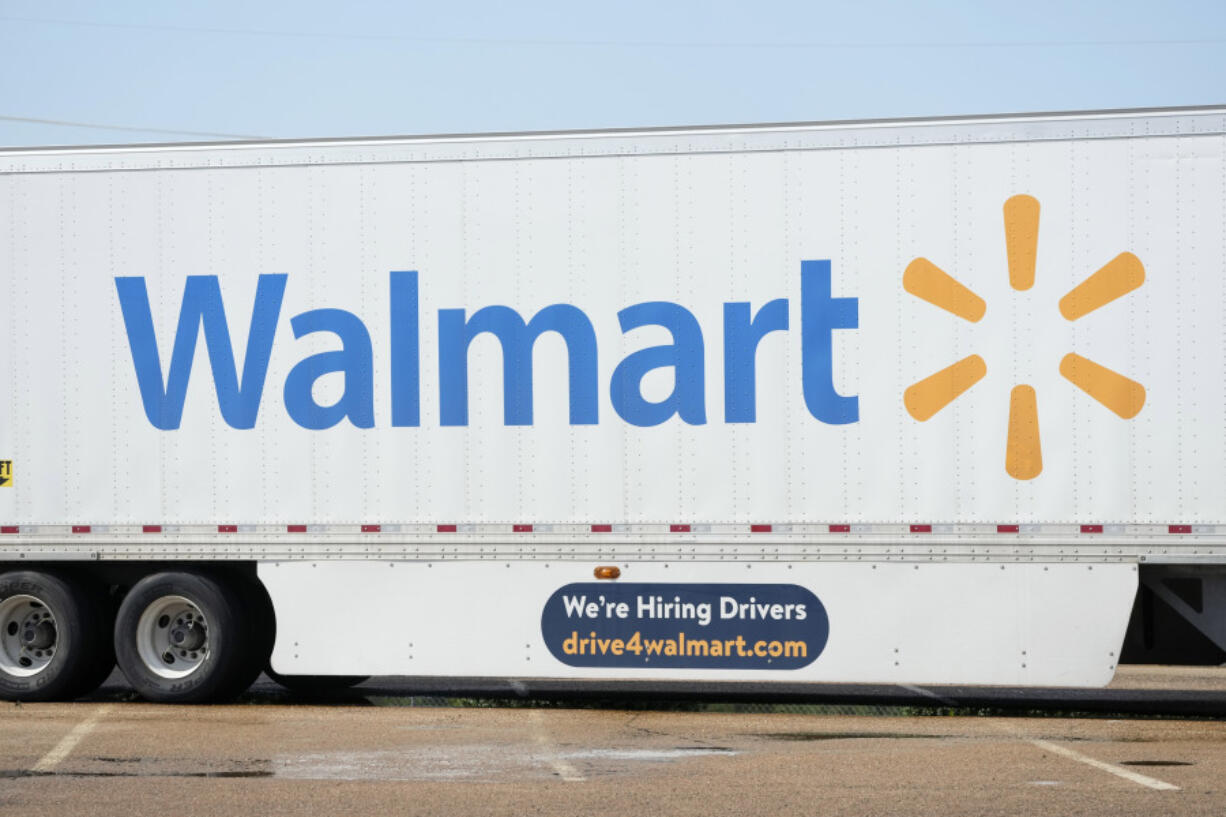 FILE - A tractor trailer bearing the Walmart logo also serves the dual purpose of advertising the company&rsquo;s need for tractor trailer drivers as seen in Richland, Miss., Sept. 6, 2023. Walmart is further sweetening the perks for its U.S. store managers as the nation&rsquo;s largest retailer and private employer seeks to retain and attract top workers in a still competitive job market. Walmart, which is based in Bentonville, Ark. and has almost 4,700 U.S. namesake stores, said Monday, Jan. 29, 2024 that starting with the company&rsquo;s new fiscal year, which begins Thursday, U.S. store leaders will receive up to $20,000 in Walmart stock grants every year. (AP Photo/Rogelio V.