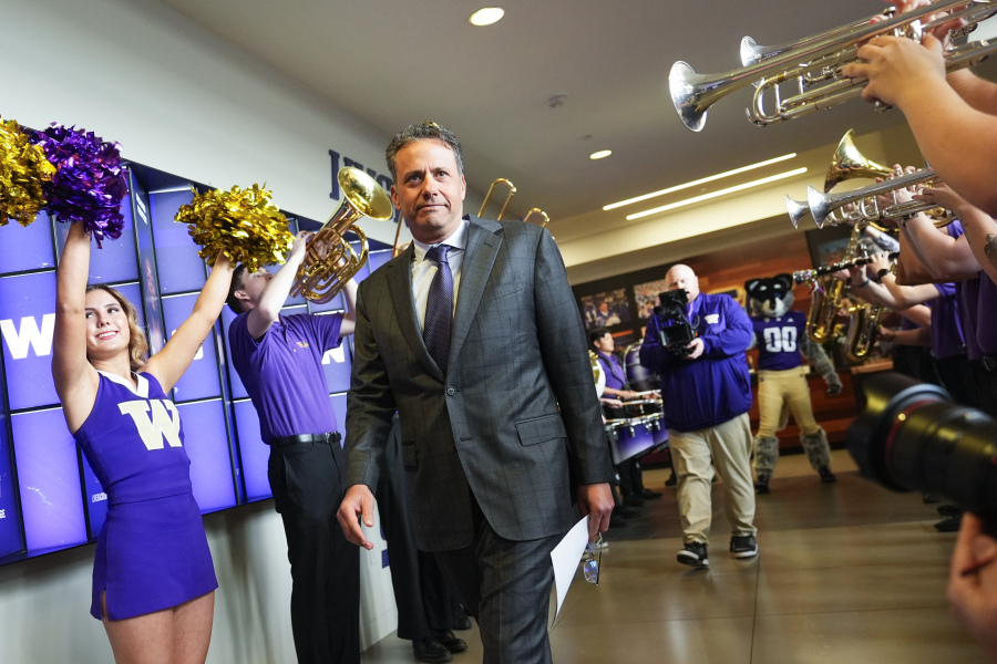 New Washington head coach Jedd Fisch arrives for an NCAA college football press conference Tuesday, Jan. 16, 2024, in Seattle.