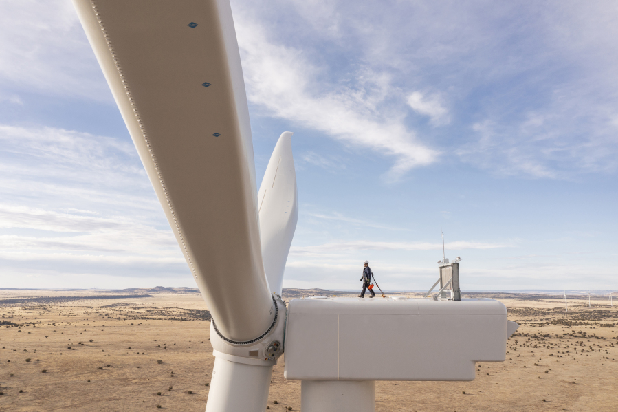 This undated image provided by GE Vernova shows a worker atop a wind turbine at the Borderland Wind Project in western New Mexico near the Arizona state line. GE Vernova has received a record order for 674 turbines that will be used for the SunZia Wind Project in central New Mexico, which is expected to be the largest wind farm in the Western Hemisphere when it comes online in 2026.