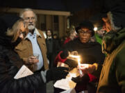 Homeless Persons&rsquo; Memorial Day attendees light candles Dec. 21 at St. Paul Lutheran Church in downtown Vancouver. Between mid-December and late January eight homeless people died. Last year, 43 people experiencing homelessness or who are connected to the unhoused community died.