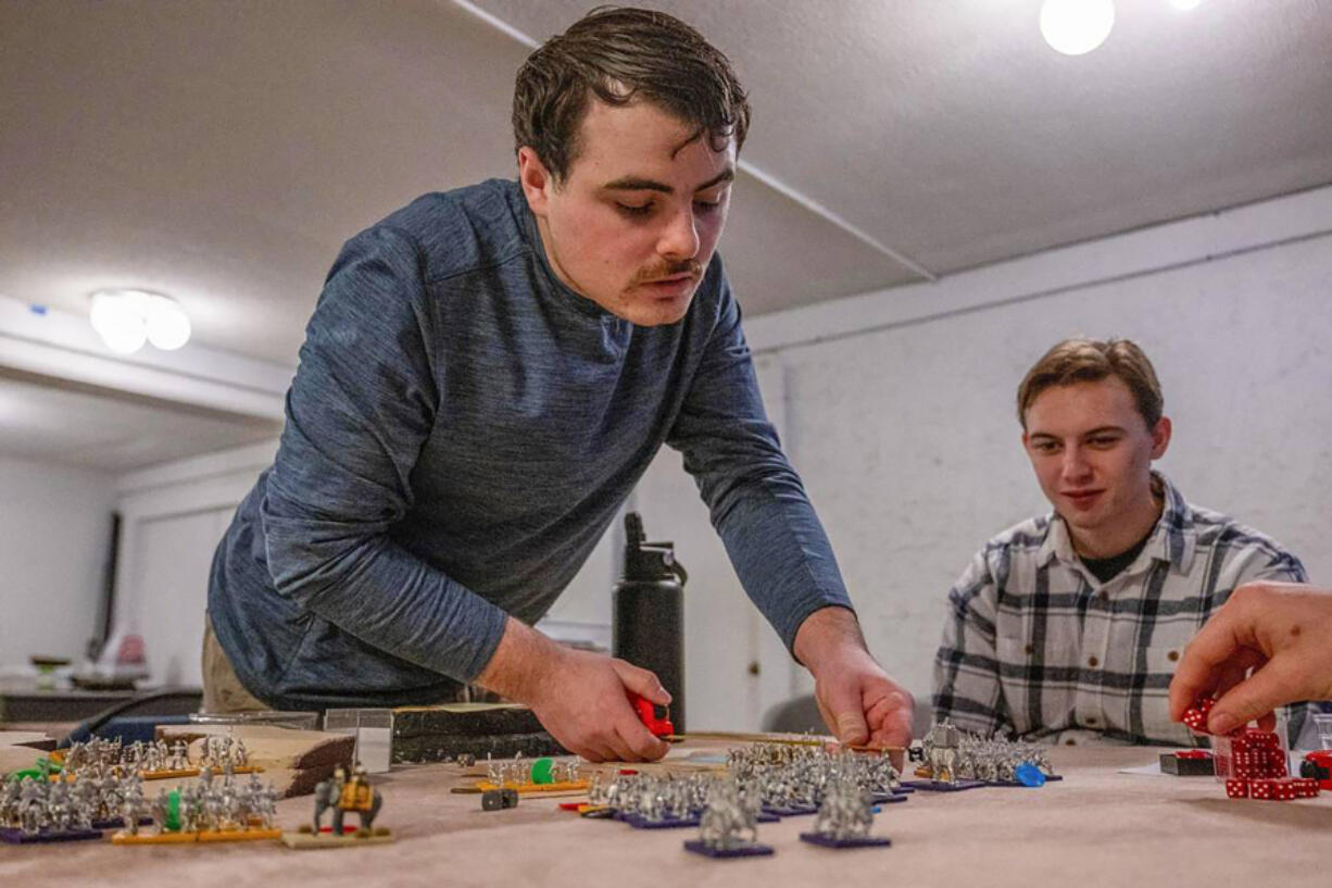 Scott Broyles, 23, leader of the Blemmye army, ancient soldiers from Africa, calculates dice rolls against his foe as part of the Baker University class, &ldquo;Get the Lead Out: Understanding History Through Tabletop Wargaming&rdquo; in Baldwin City, Kan.