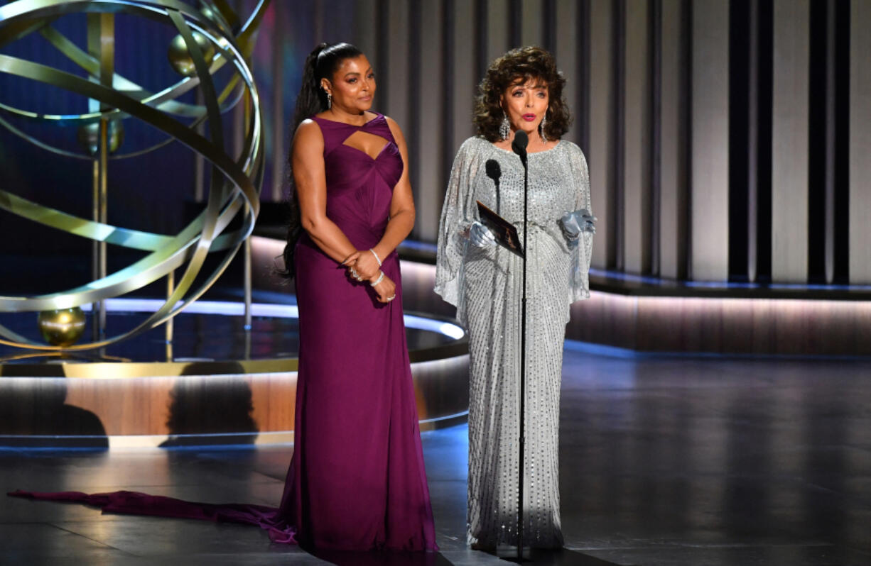Actress Taraji P. Henson, left, and Dame Joan Collins speak Jan. 15 during the 75th Emmy Awards at the Peacock Theatre at L.A. Live in Los Angeles.