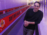 Dublab Executive Director Alejandro Cohen poses for a portrait on the moving walkway at LAX on Jan. 18, 2023, in Los Angeles. Curated by the LA radio station Dublab, the orchestrina takes short original compositions from 30 LA composers and musicians and blends them into a seamless, ever-evolving ambient soundtrack for traveling between gates in a new pedestrian tunnel.