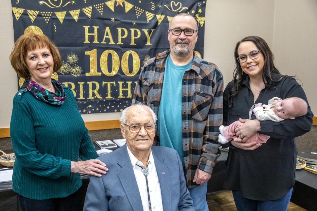 Floyd Thomason, center, is surrounded by his daughter Susan Hall, grandson Brad Geagley, great-granddaughter McKenzie Funke and great-great-granddaughter Wrenlee Funke, 2 months, for a five-generation photo during Thomason&rsquo;s 100th birthday party Feb. 3 at the Lewiston Community Center in Idaho. His birthday was Feb. 4.