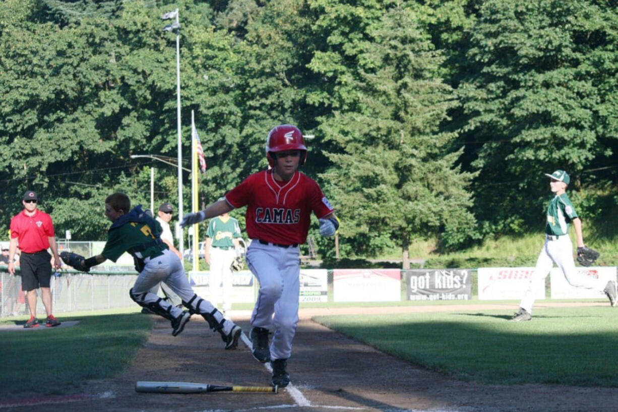 The Camas 11- to 12-year-old all-star team plays in the district championship game at Forest Home Park in Camas in July 2014.