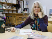 Founder and president Marlys Lamar sits Jan. 22 at The Art Room, a nonprofit art studio, in Denton, Texas.