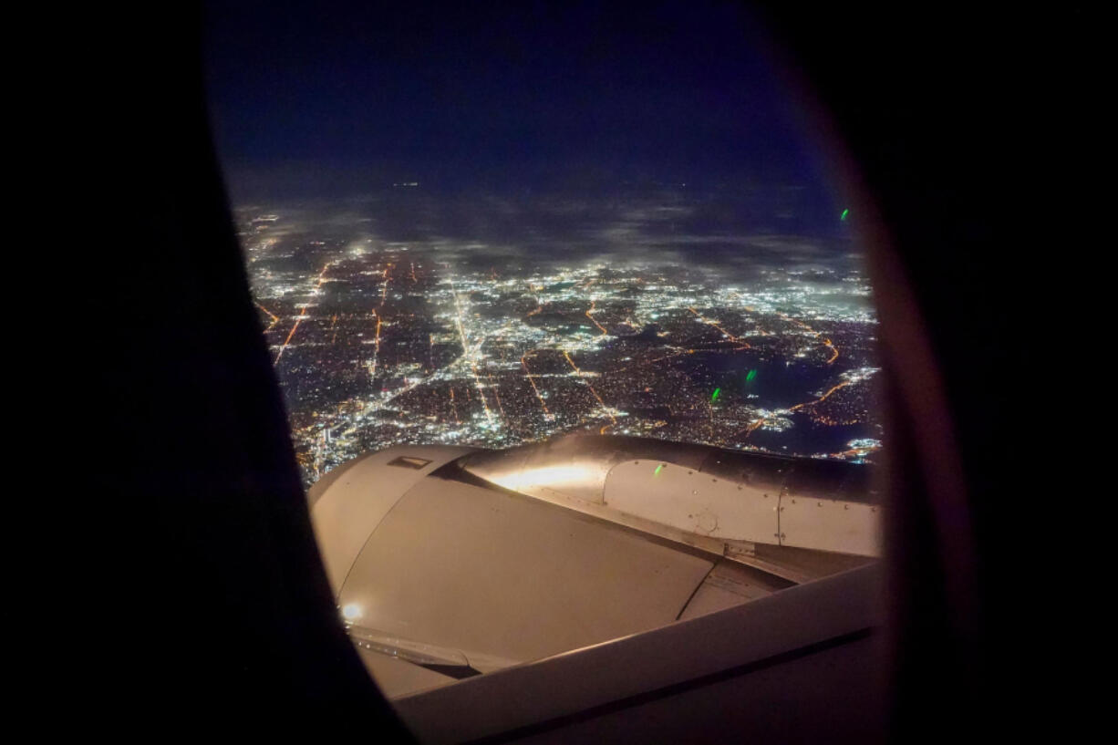The lights of Dallas are seen Feb. 3 from a flight on approach for DFW Airport. (Photos by Smiley N.