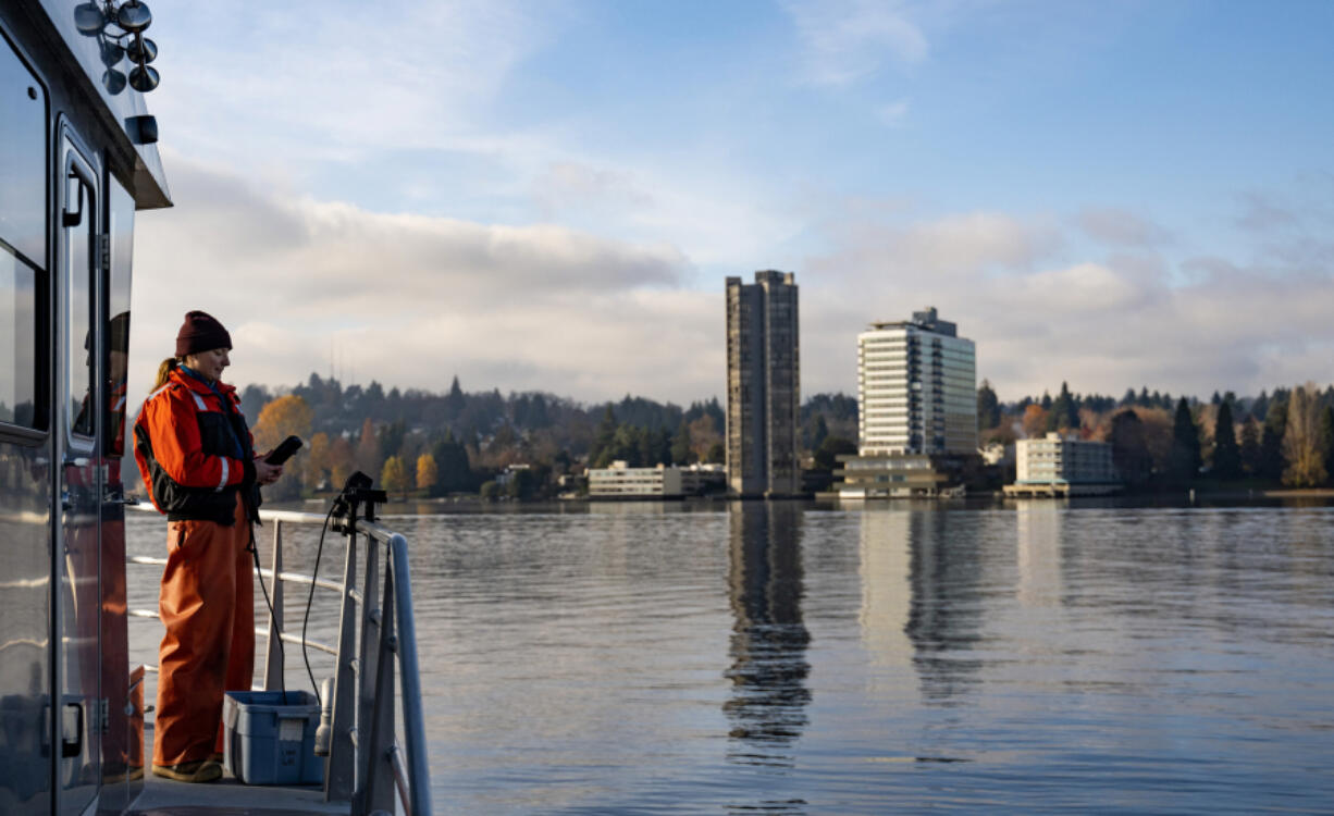 King County environmental lab scientist Mattie Michalek performs a test at Lake Washington&rsquo;s deepest location on Nov. 27 in Seattle. Her team is testing the lake to monitor its overall health and to identify temperature trends over a long period of time.