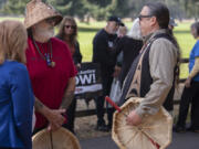 Sam Robinson, left, of the Chinook Indian Nation talks with Tony Johnson, the Chinook Indian Nation chairman, as they join a rally in favor of federal recognition for the Chinook Tribe at Fort Vancouver National Historic Site on Oct. 7, 2022.