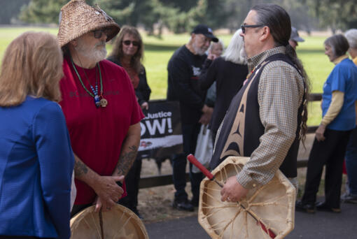 Sam Robinson, left, of the Chinook Indian Nation talks with Tony Johnson, the Chinook Indian Nation chairman, as they join a rally in favor of federal recognition for the Chinook Tribe at Fort Vancouver National Historic Site on Oct. 7, 2022.