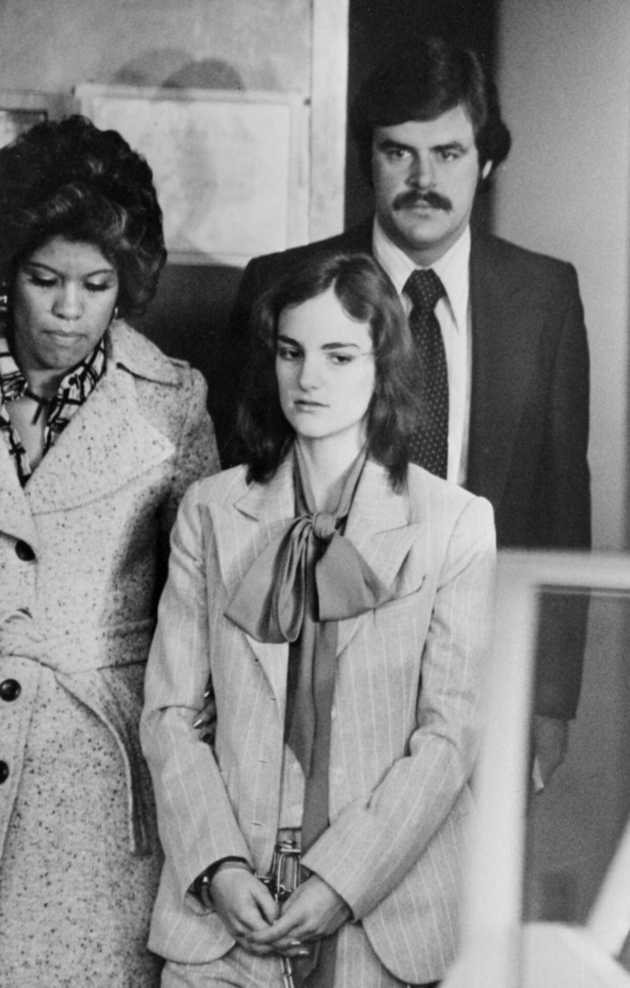 Patty Hearst makes her way to court on Feb. 17, 1976, during her trial on charge of bank robbery.