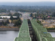 Cars travel along the Interstate 5 Bridge in October 2022, as seen from the top of one of the northbound bridge lift towers. Tolling on the current I-5 Bridge, to help pay for its replacement, is expected to start in 2026.