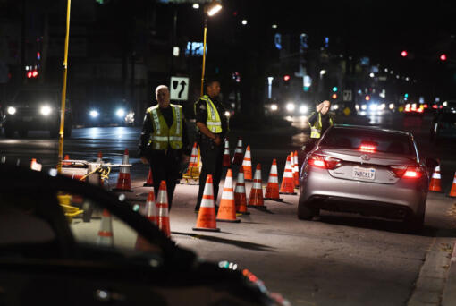 LAPD police check drivers at a DUI checkpoint in Reseda, Los Angeles, on April 13, 2018.
