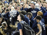 Skyview players celebrate with the Storm student section following their 55-47 win over Federal Way in a Class 4A Hardwood Classic Round-Of-12 game on Wednesday, Feb. 28, 2024, at the Tacoma Dome.