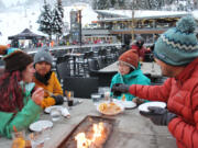 Whistler Blackcomb draws visitors from near and far, like this group from Atlanta enjoying apres food and drinks at the Longhorn Pub after a day of skiing.