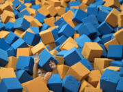 A child plays in the foam pit at SkyZone in Vancouver in  2017.