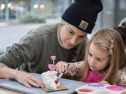 Keana Zoradi of Vancouver, left, joins her daughter, Eden, 3, while creating a Valentine's Day sculpture at Drip Drop Art Studio on Jan. 31. It’s one of several recently opened businesses geared toward Clark County’s youngest residents.