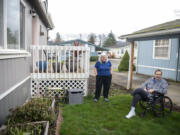 Phil Zorich, right, looks over his vegetable garden with his wife Robin on Tuesday. With rising rents, the Zoriches grow vegetables to offset their grocery bill.
