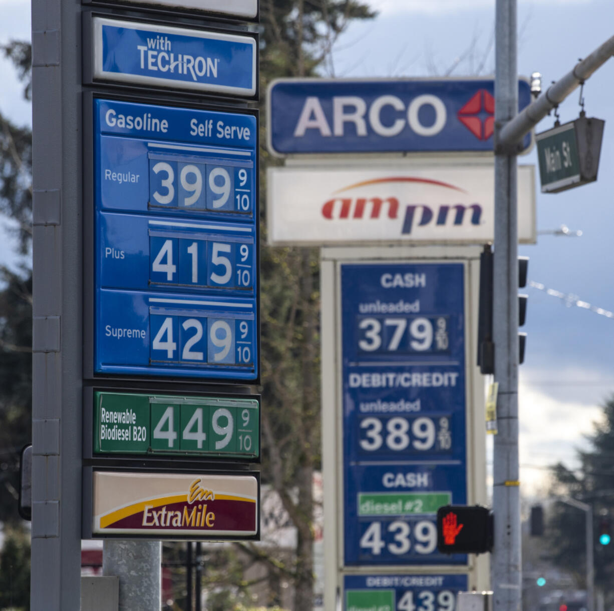 Gas stations display their prices Tuesday in Vancouver. Average pump prices were slightly down Tuesday compared with last month, while prices are on the rise in most other parts of the country.