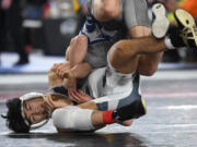 Union junior Noah Koyama, left, wrestles in the 4A 138-pound championship match Saturday, Feb. 17, 2024, during the Mat Classic state wrestling tournament at Tacoma Dome. Koyama won by decision, 4-2, over Chiawana’s Daeton Johnson.