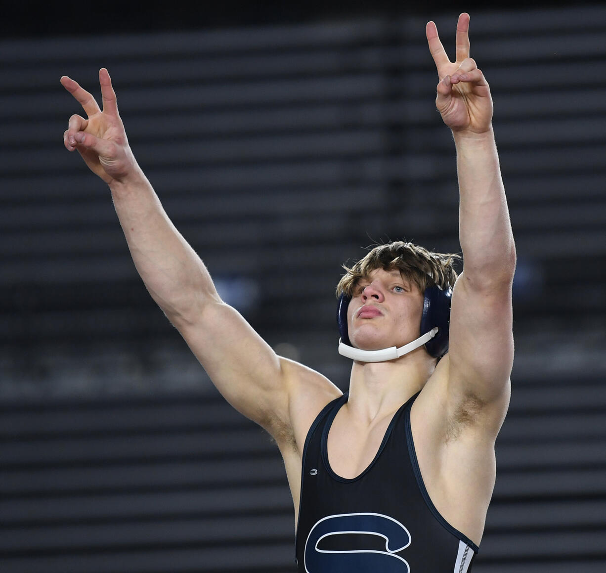 Skyview junior JJ Schoenlein celebrates back-to-back championships Saturday, Feb. 17, 2024, after the 4A 175-pound championship match at the Mat Classic state wrestling tournament at Tacoma Dome. Schoenlein beat Sumner’s Matt King by major decision, 10-2.