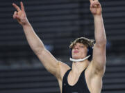 Skyview junior JJ Schoenlein celebrates back-to-back championships Saturday, Feb. 17, 2024, after the 4A 175-pound championship match at the Mat Classic state wrestling tournament at Tacoma Dome. Schoenlein beat Sumner’s Matt King by major decision, 10-2.