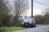 A city of Vancouver police vehicle blocks the driveway to a residence Feb. 20 in Brush Prairie, where Clark County sheriff&rsquo;s deputies fatally shot a man while responding to a welfare check.