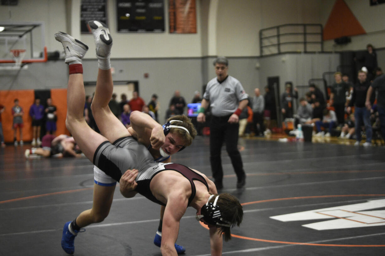Hockinson junior Jacob McKee, back, wrestles against Graysen Serl of W.F. West in the 144-pound title match at the 2A Boys Region 3 Wrestling Championships on Saturday, Feb. 10, 2024 at Washougal High School (Micah Rice/The Columbian).