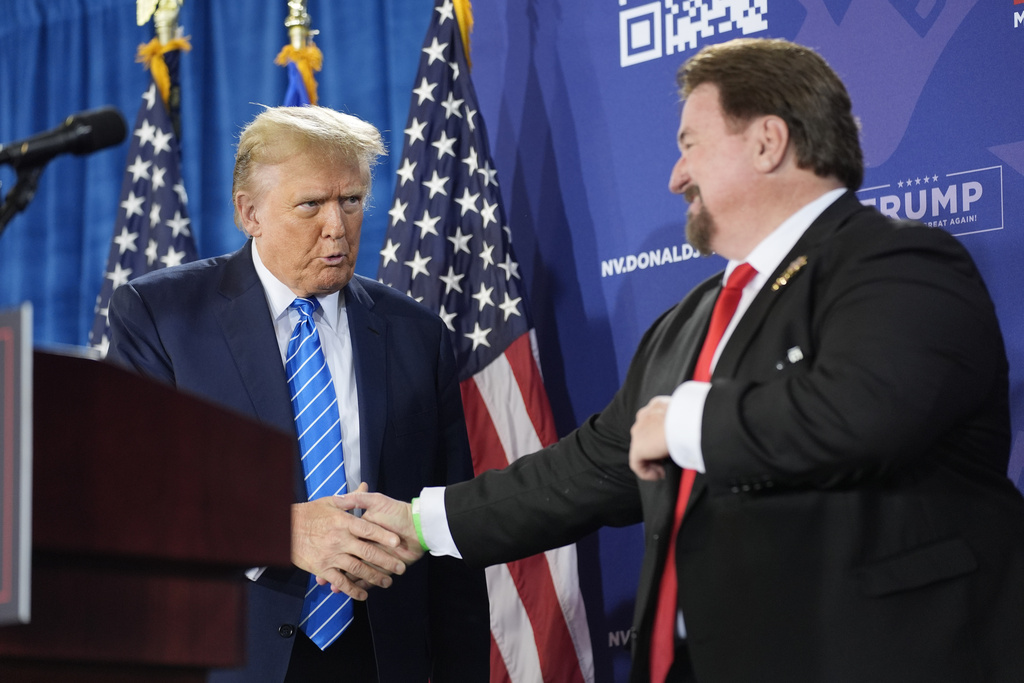 FILE - Nevada GOP chair Michael McDonald, right, shakes hands with Republican presidential candidate former President Donald Trump at a campaign event, Jan. 27, 2024, in Las Vegas.