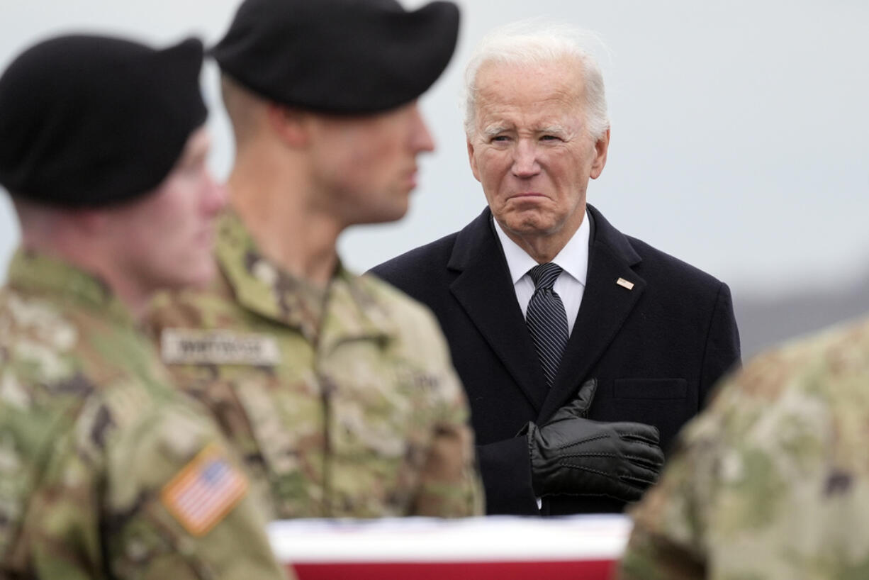 President Joe Biden watches as an Army carry team moves the flag-draped transfer case containing the remains of U.S. Army Sgt. Breonna Alexsondria Moffett, 23, of Savannah, Ga., during a casualty return at Dover Air Force Base, Del., Friday, Feb. 2, 2024. Moffett was killed in a drone attack in Jordan on Jan. 28.