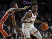 Southern California guard Bronny James (6) dribbles against Oregon State guard Christian Wright (1) during the first half of an NCAA college basketball game in Los Angeles, Saturday, Feb. 3, 2024.