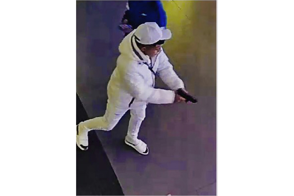 This surveillance image taken from a wanted poster provided by New York City Police Department Deputy Commissioner of Operations Kaz Daughtry on Friday, Feb. 9, 2024, shows a suspected shoplifter who shot a tourist in the leg inside a Times Square, New York, sporting goods store  on Thursday, Feb. 8, 2024, who then fled into the street, stopping to shoot at a pursuing police officer.