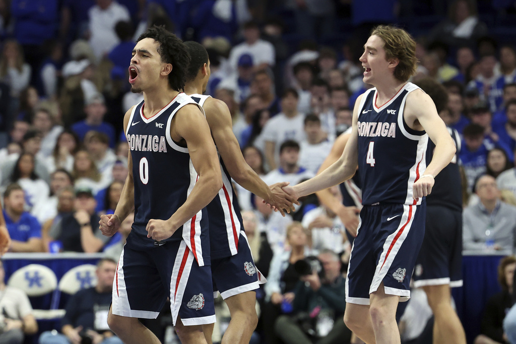 Gonzaga's Ryan Nembhard (0) and Dusty Stromer (4) celebrate the team's win over Kentucky in an NCAA college basketball game Saturday, Feb. 10, 2024, in Lexington, Ky.