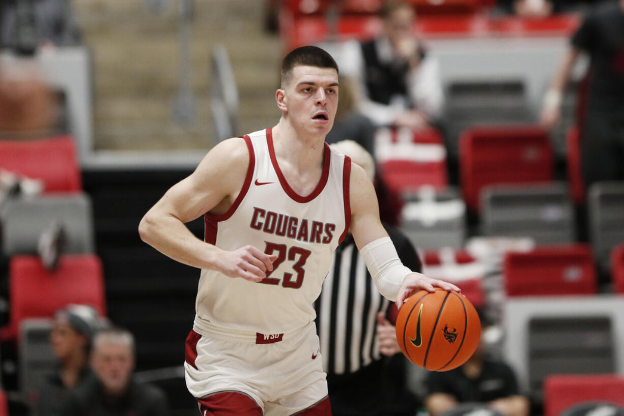Washington State forward Andrej Jakimovski controls the ball during the second half of an NCAA college basketball game against California, Thursday, Feb. 15, 2024, in Pullman, Wash.