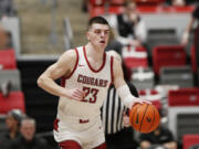 Washington State forward Andrej Jakimovski controls the ball during the second half of an NCAA college basketball game against California, Thursday, Feb. 15, 2024, in Pullman, Wash.