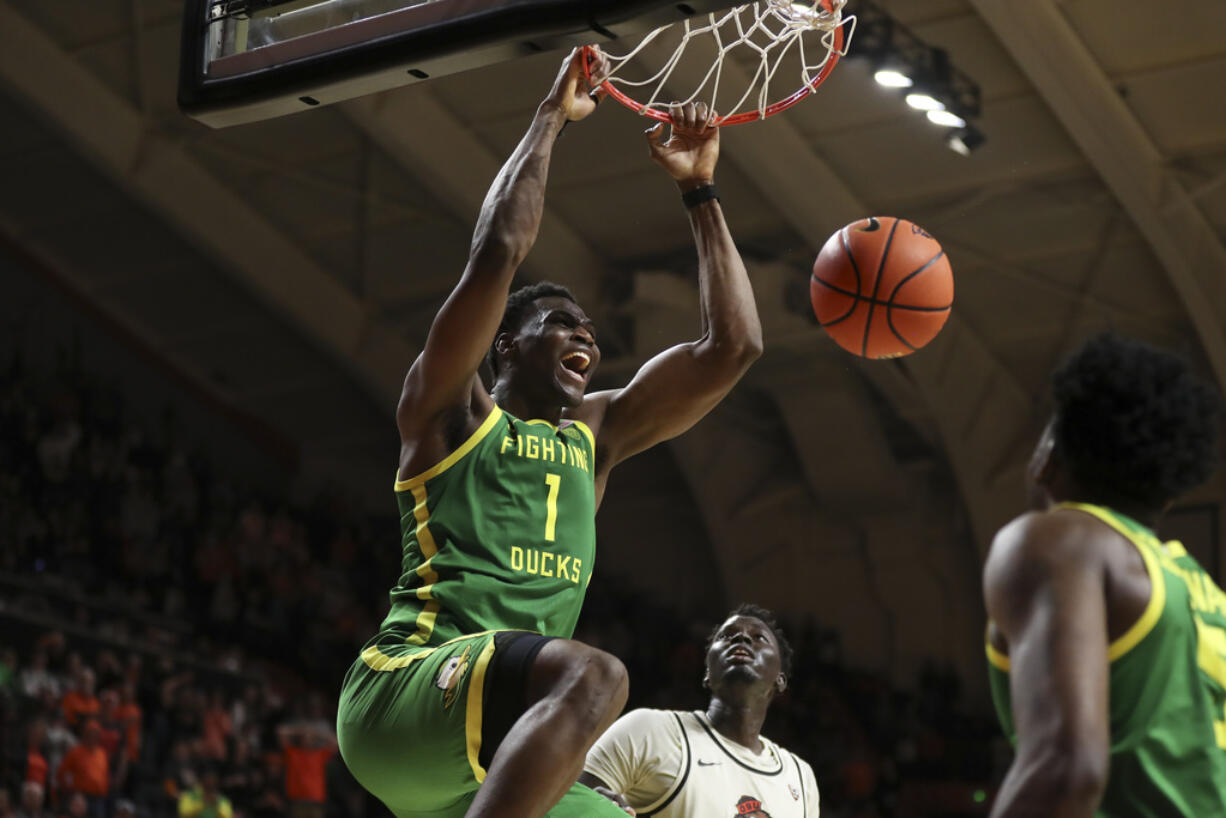 Oregon center N'Faly Dante (1) dunks against Oregon State in the final seconds of an NCAA college basketball game Saturday, Feb. 17, 2024, in Corvallis, Ore.