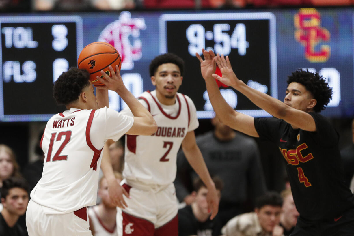 Washington State guard Isaiah Watts (12) prepares to shoot against Southern California guard Oziyah Sellers (4) during the second half of an NCAA college basketball game Thursday, Feb. 29, 2024, in Pullman, Wash.
