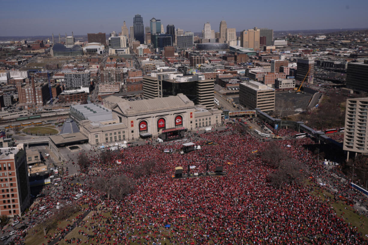 The Kansas City Chiefs celebrate during their victory parade in Kansas City, Mo., Wednesday, Feb. 14, 2024. The Chiefs defeated the San Francisco 49ers Sunday in the NFL Super Bowl 58 football game.