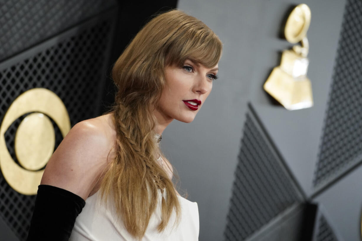 FILE - Taylor Swift arrives at the 66th annual Grammy Awards on Feb. 4, 2024, in Los Angeles. A photographer told police he was punched in the face by Taylor Swift&rsquo;s father on the Sydney waterfront on Tuesday, Feb. 27, 2024, hours after the pop star&rsquo;s Australian tour ended.