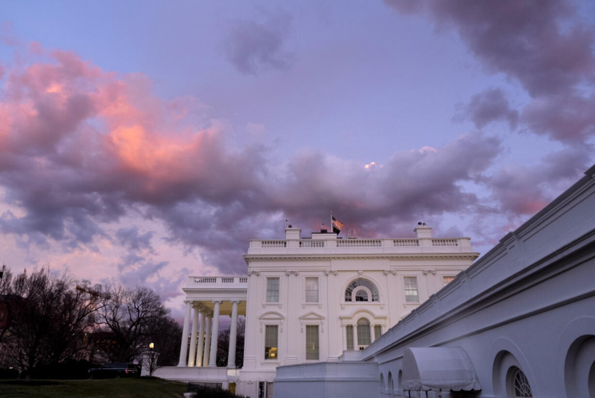 The White House is seen at sunset in Washington, Friday, Jan. 26, 2024.