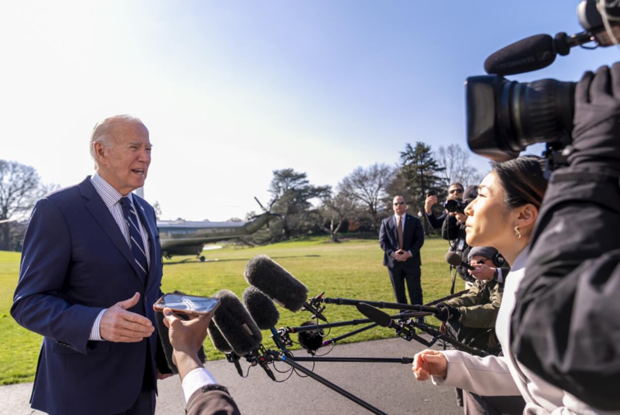 President Joe Biden speaks to members of the media as he arrives at the White House in Washington, Monday, Feb. 19, 2024, after returning from Rehoboth Beach, Del.