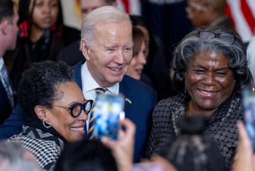 President Joe Biden takes a photograph with Housing and Urban Development Secretary Marcia Fudge, left, and United States Ambassador to the United Nations Linda Thomas-Greenfield, right, during a reception in recognition of Black History Month in the East Room of the White House in Washington, Tuesday, Feb. 6, 2024.