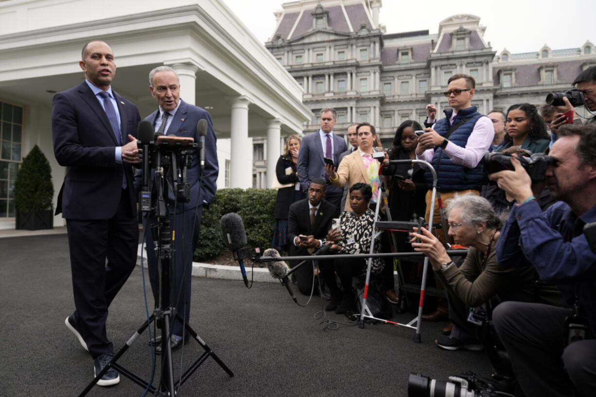 House Minority Leader Hakeem Jeffries, D-N.Y., speaks as Senate Majority Leader Chuck Schumer of N.Y., listens as they talk with reporters outside the West Wing after meeting with President Joe Biden at the White House in Washington, Tuesday, Feb. 27, 2024.