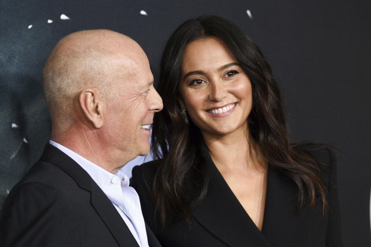 Actor Bruce Willis, left, and his wife, Emma Heming Willis, attend the premiere of &ldquo;Glass&rdquo; in New York on Jan. 15, 2019. Heming Willis is working on a guide to caregiving that draws upon her experiences tending to her husband.