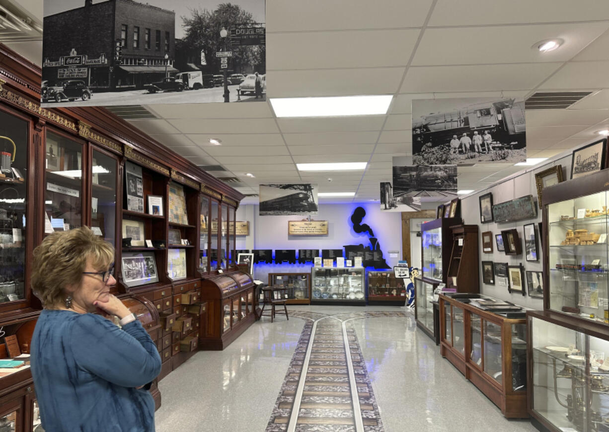 Mayor Linda Horning Pitt stands Feb. 8 amid railroad-themed displays at the Crestline Historical Museum in Crestline, Ohio.