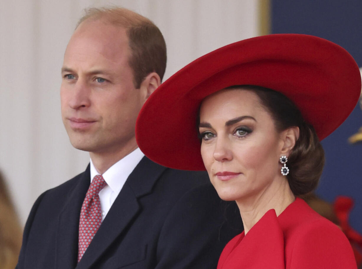 FILE - Britain&rsquo;s Prince William, left, and Britain&rsquo;s Kate, Princess of Wales, attend a ceremonial welcome for the President and the First Lady of the Republic of Korea at Horse Guards Parade in London, England on Nov. 21, 2023. Charles&rsquo; illness comes at a awkward time, as his daughter in law, the Princess of Wales, has also had her own health issues, having recently been hospitalized for two weeks following abdominal surgery following at the private London clinic.