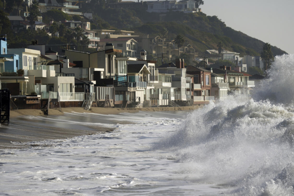 FILE - Waves break near beach homes in Malibu, Calif., on Dec. 28, 2023. An earthquake with a preliminary magnitude of 4.6 struck the Southern California coast near Malibu on Friday, Feb. 9, 2024, and was widely felt in the Los Angeles region.