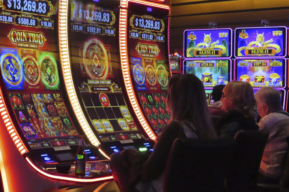 Gamblers play slot machines at the Ocean Casino Resort in Atlantic City, N.J. on Nov. 29, 2023. Figures released on Tuesday, Feb. 20, 2024, by the American Gaming Association show that the U.S. commercial casino industry had its best year ever in 2023, winning $66.5 billion from gamblers. When figures from tribal casinos are tallied later this year, the combined total is expected to approach $110 billion for 2023.